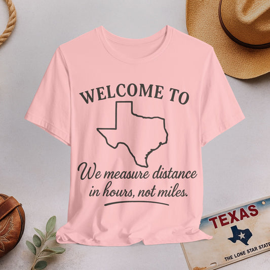 Texas Road Trip T‑Shirt — "Welcome to... We measure distance in hours, not miles."